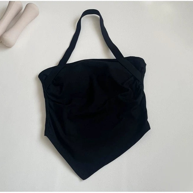 Black halter top on a light gray background